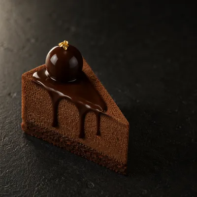 Elegant Chocolate Cake Slice on Dark Background
