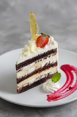 Elegant Layer Cake Slice with Strawberry Garnish
