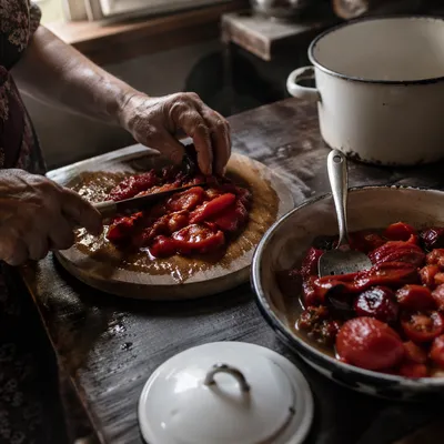 Hands Preparing Vegetables in Rustic Kitchen