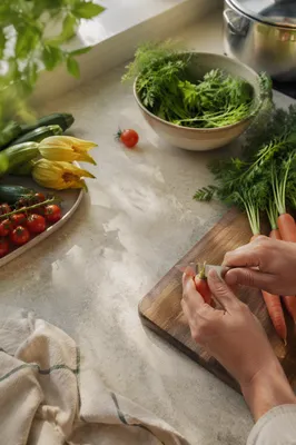 Hands Preparing Fresh Vegetables in Kitchen