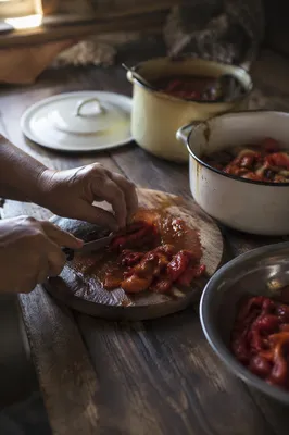 Hands Preparing Vegetables in Rustic Kitchen