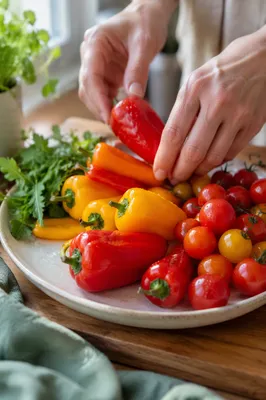 Hands Preparing Fresh Vegetables in Kitchen