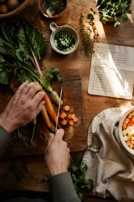 Hands Preparing Vegetables in Warm Kitchen Light