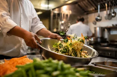 Hands Preparing Vegetables in Commercial Kitchen