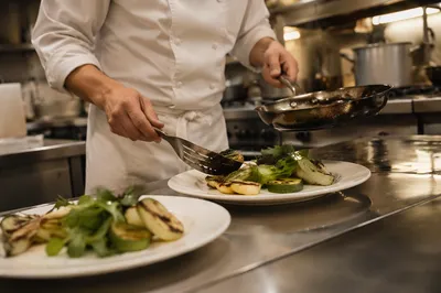 Chef Hands Plating Grilled Vegetables