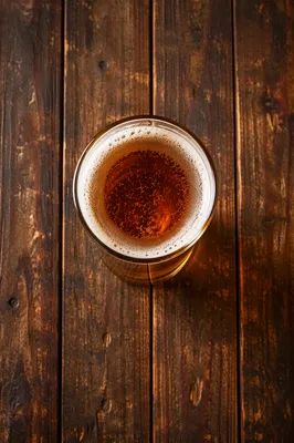 Amber Craft Beer on Rustic Pub Table