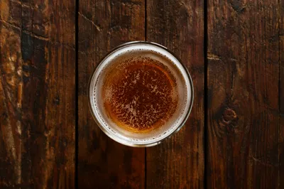 Amber Craft Beer on Rustic Pub Table