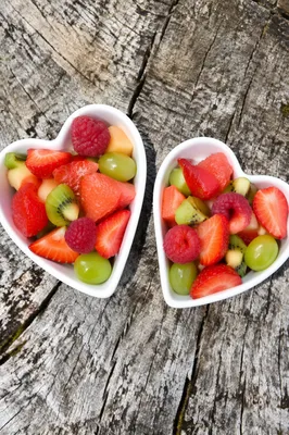 Colorful Fresh Fruit Bowls on Rustic Wood