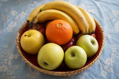 Colorful Fresh Fruit Basket on Blue Tablecloth