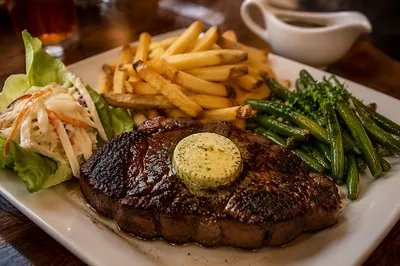Hearty Grilled Steak Dinner with Herb Butter