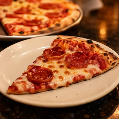 Fresh Pepperoni Pizza Slice on White Plate