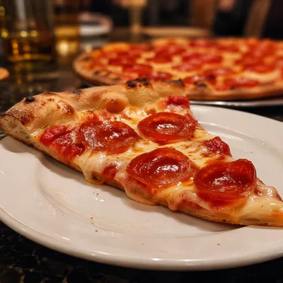 Fresh Pepperoni Pizza Slice on White Plate