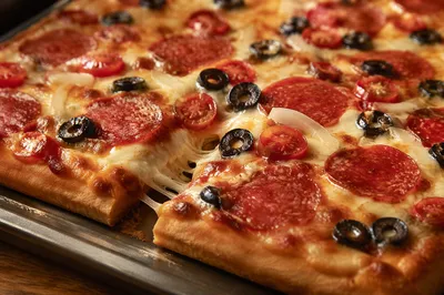 Fresh Pepperoni Pizza Slice with Melted Cheese