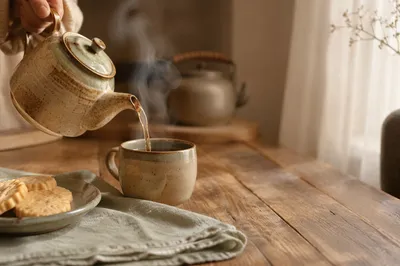 Cozy Ceramic Teapot Pouring Morning Tea