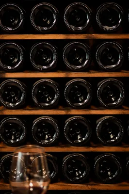Moody Wine Bottles in Cellar Rack