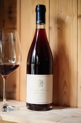 Rustic Red Wine Bottle in Cellar