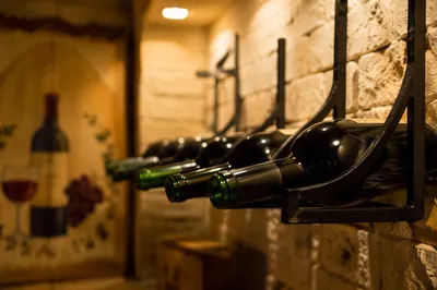 Rustic Wine Bottles in Cozy Cellar