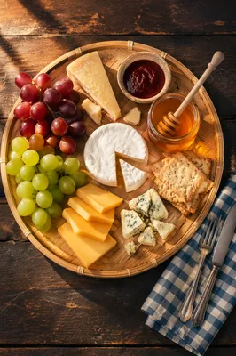 Rustic Cheese Board with Honey and Grapes