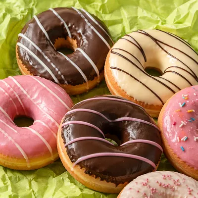 Colorful Glazed Donuts on Lime Parchment