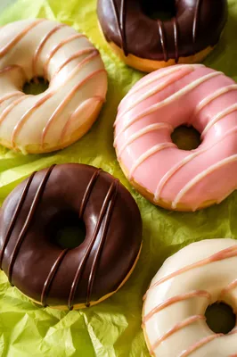 Colorful Glazed Donuts on Lime Parchment