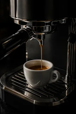 Espresso Shot Pouring Into White Cup