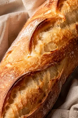 Rustic French Baguette on Natural Linen