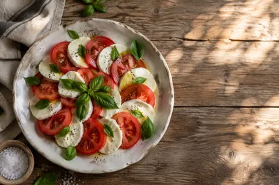 Sunlit Caprese Salad on Rustic Table