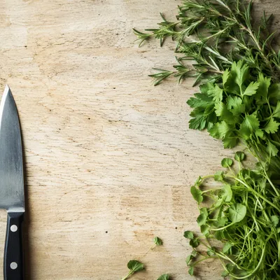 Fresh Garden Herbs on Rustic Cutting Board