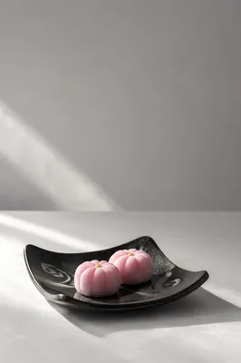 Minimal Pink Wagashi on Black Ceramic Plate