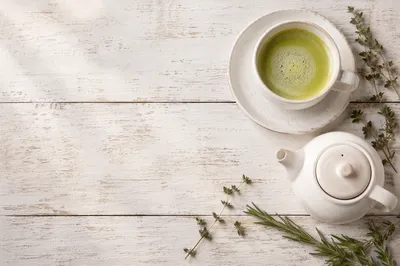 Overhead Matcha Latte on White Wood