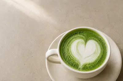 Overhead Matcha Latte on Greige Table
