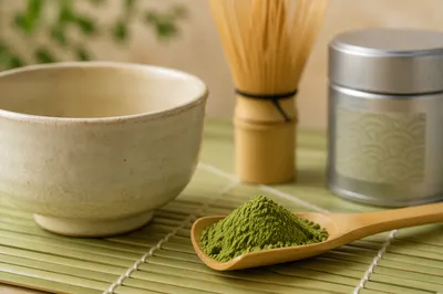 Matcha Powder in Bamboo Scoop and Ceramic Bowl
