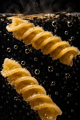 Steaming Golden Pasta in Boiling Water