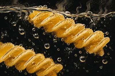 Steaming Golden Fusilli in Boiling Water