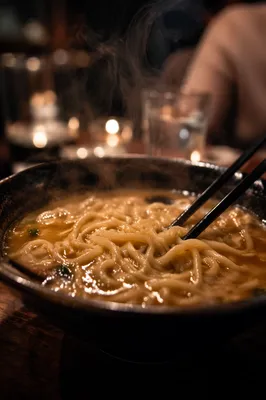 Steaming Ramen Bowl with Black Chopsticks