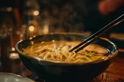 Steaming Ramen Bowl with Black Chopsticks