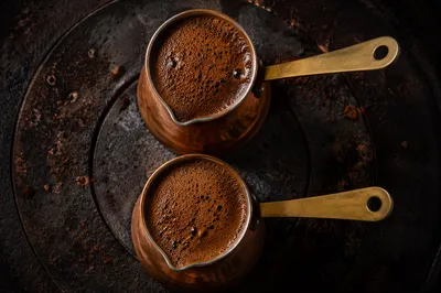 Foaming Turkish Coffee in Copper Pots