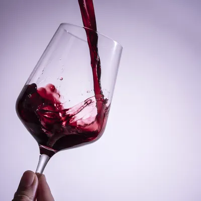 Elegant Red Wine Pour in Glass