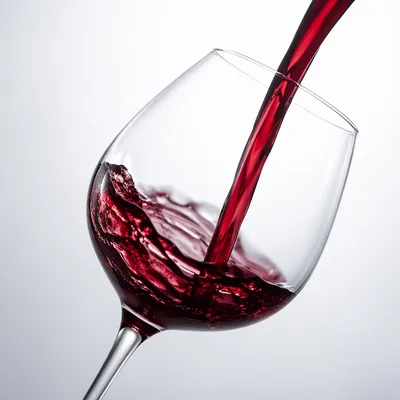 Elegant Red Wine Pour in Glass