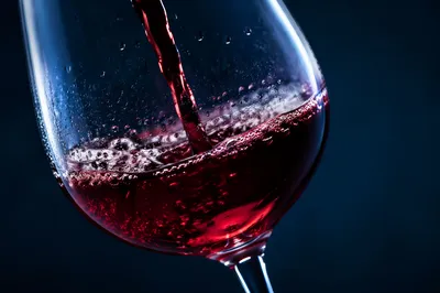 Elegant Red Wine Pour in Glass
