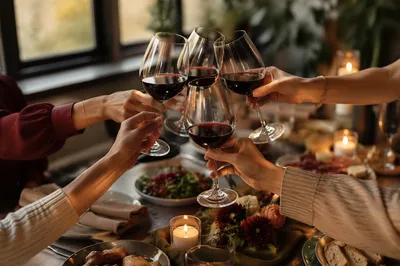 Elegant Wine Glass Cheers at Dinner