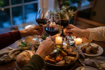 Elegant Wine Glass Toast at Dinner