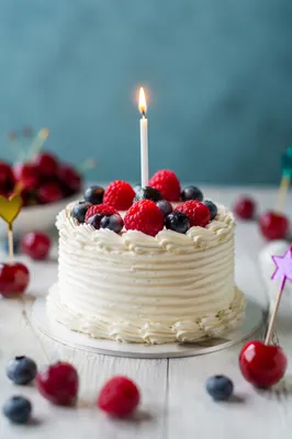 Birthday Cake With Candle and Fresh Berries