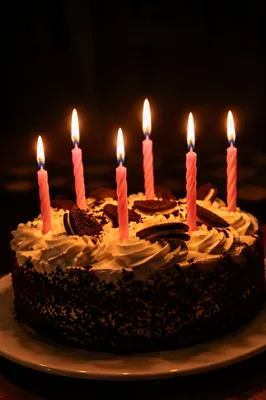 Glowing Birthday Candles on Chocolate Cake