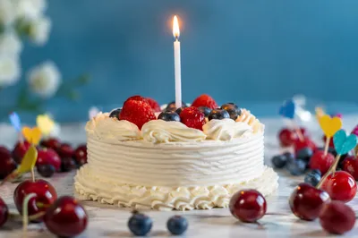 Birthday Cake With Candle and Fresh Berries