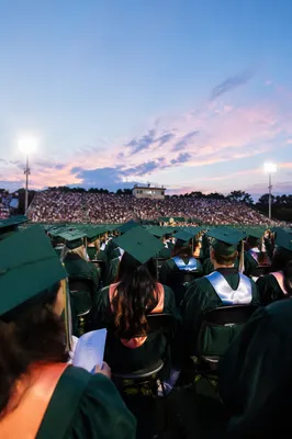 Hopeful Outdoor Graduation Ceremony at Dusk