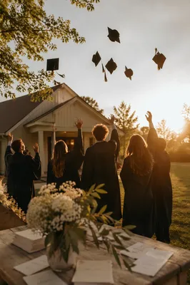 Spring Graduation Caps Outside Wooden Chapel