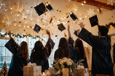 Warm Graduation Cap Celebration Under String Lights
