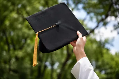 Graduation Cap Raised in Outdoor Celebration