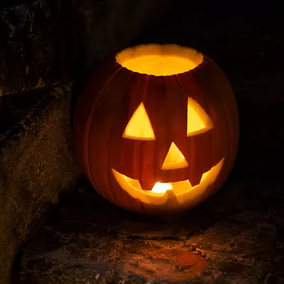 Glowing Jack O Lantern on Stone Steps